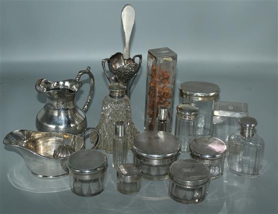 Various silver topped glass jars and plated items